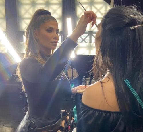 Applying makeup on set